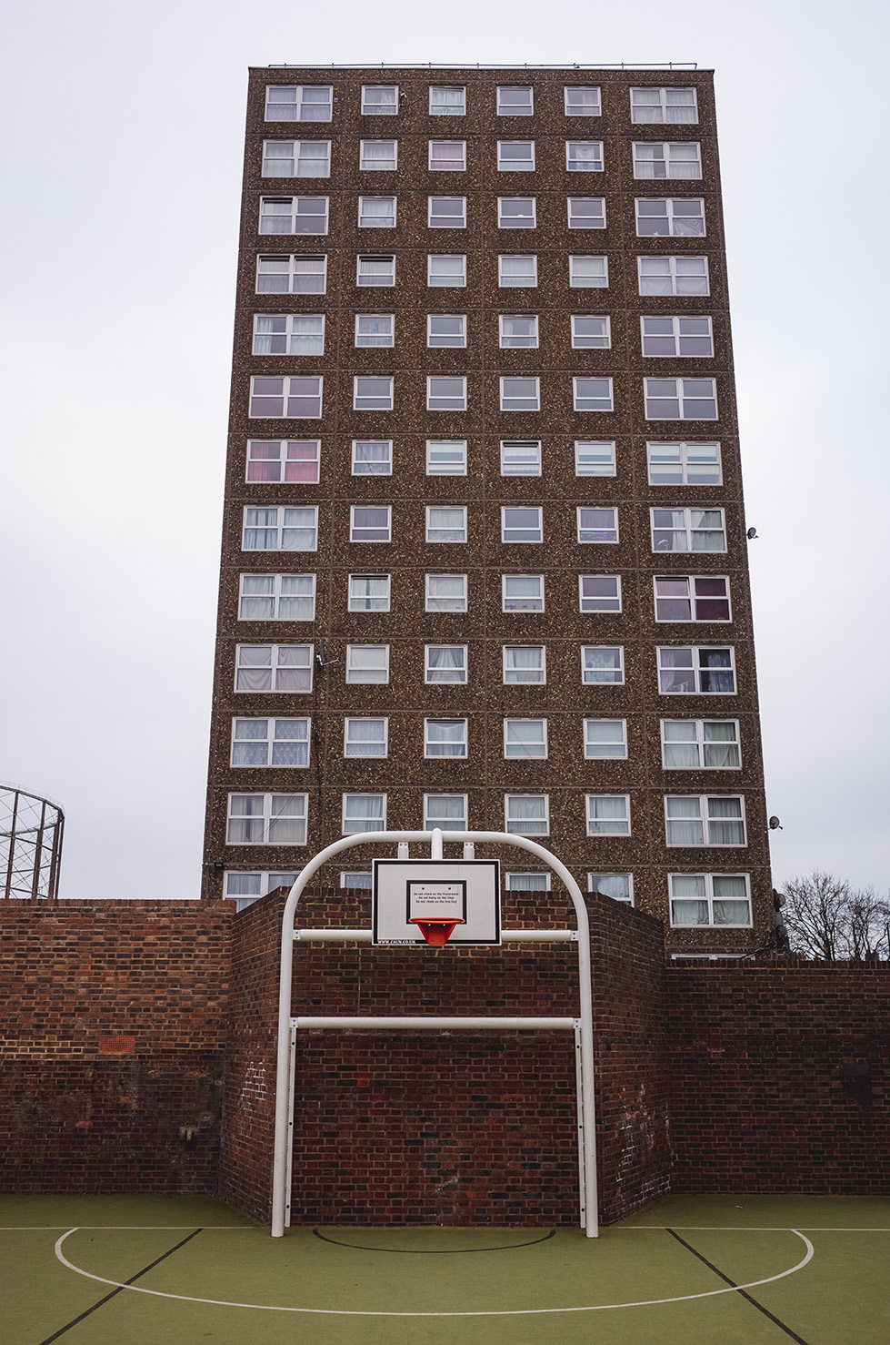 Basketball court in front of tower block - Ledbury Estate, Peckham, South London.