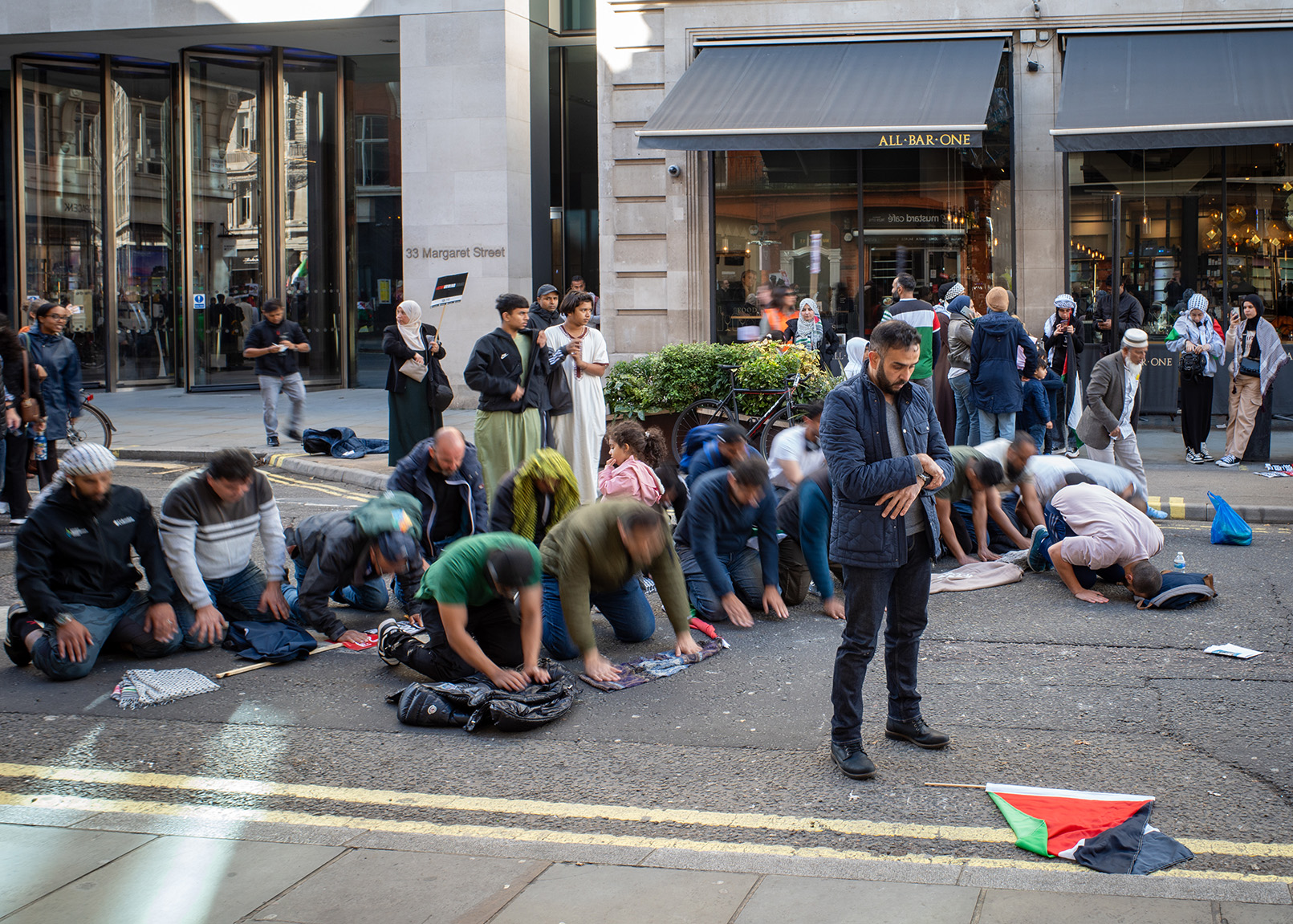 Muslims pray on a side street in Central London during a Pro Palestine march.