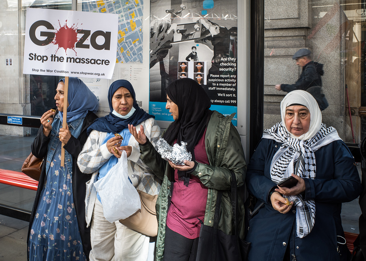 Pro Palestinian women protesters at a bus stop in Central London.